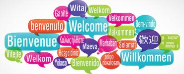 Tekstballonnen met 'welkom' in verschillende talen